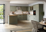 Modern Rydal kitchen with reed green cabinet doors and wooden worktops.