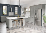 Modern kitchen with grey cabinets, stainless steel appliances, and a island.