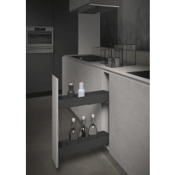Modern kitchen with open cabinet revealing bottles and glasses.