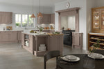 Modern kitchen with wooden cabinets and island, featuring a clock on the wall.