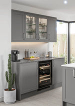 Stratto kitchen with dust grey cabinets, a wine cooler, and a potted cactus.