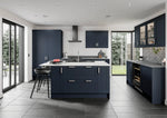 Modern Stratto kitchen with indigo doors and white countertops. Featuring two glazed doors.