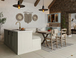 Modern shaker kitchen with island, dining table, and chairs. Features glazed wall cabinet doors and tongue and groove panelling.
