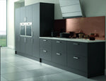 Modern Vivo kitchen with dark grey cabinets, appliances, white marble worktop and a copper backsplash.