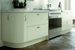 Modern Vivo kitchen with ivory cabinets and featuring a curved door and curved plinth.
