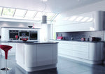 Modern Vivo kitchen with gloss white cabinets, black countertops, and a central island. Features square edge curved cornice and plinth.