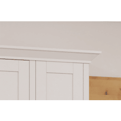 White wooden cabinet with a light gray wall and wooden floor in the background