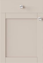 Beige cabinet door with silver knobs 