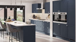 Waterford kitchen with indigo matt cabinet doors, white countertops, and grey chairs.