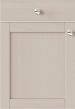 Beige cabinet door with silver knobs