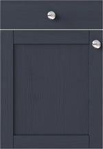 Dark blue cabinet with silver knobs