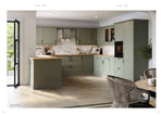Modern kitchen with green cabinets and wooden countertops