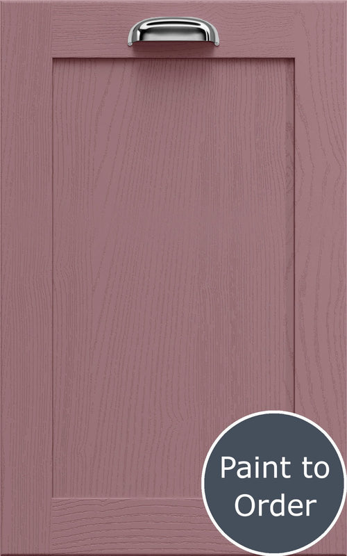 Newmarket dusky pink cabinet door with a silver handle and 'Paint to Order' label. 